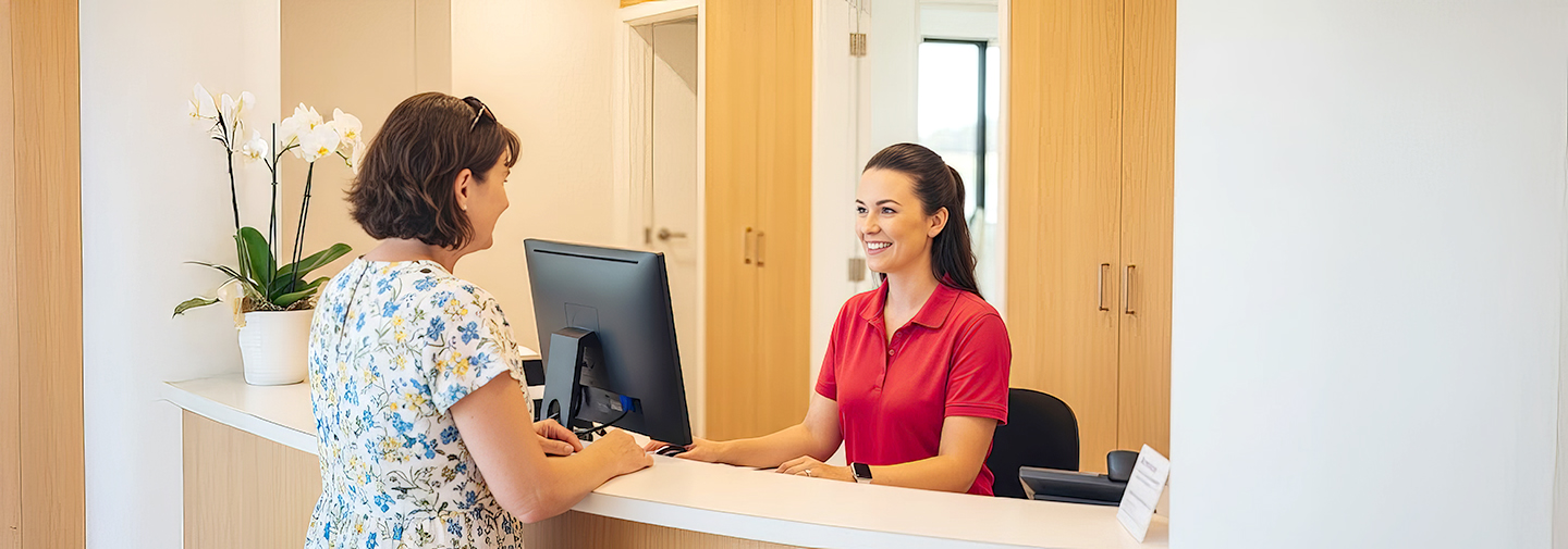 Receptionist collecting patient information